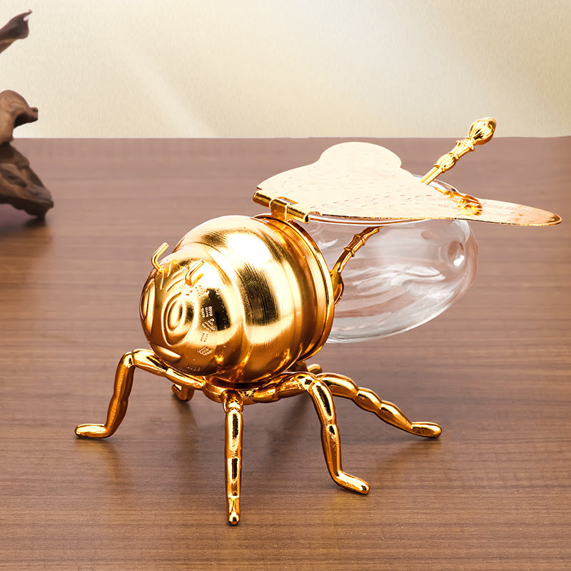 Honigglas in Bienenform als Symbol für Struktur und Zusammenhalt