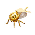 Honigglas in Bienenform als Symbol für Struktur und Zusammenhalt